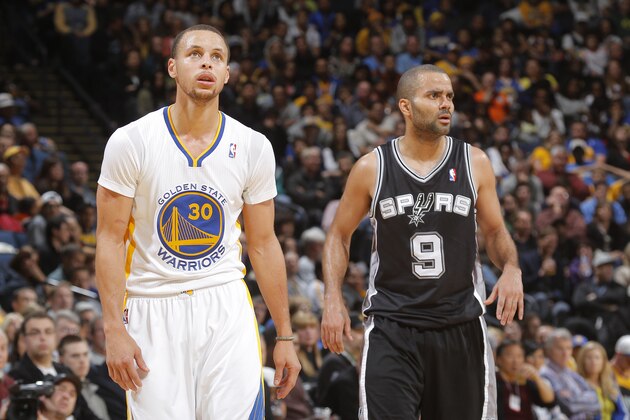 OAKLAND, CA - MARCH 22: Stephen Curry #30 of the Golden State Warriors faces off against Tony Parker #9 of the San Antonio Spurs on March 22, 2014 at Oracle Arena in Oakland, California. NOTE TO USER: User expressly acknowledges and agrees that, by downloading and or using this photograph, user is consenting to the terms and conditions of Getty Images License Agreement. Mandatory Copyright Notice: Copyright 2014 NBAE (Photo by Rocky Widner/NBAE via Getty Images)
