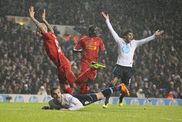 Tottenham's Paulinho, right appeals for a penalty as teammate Roberto Soldado falls to the floor following a challenge from Liverpool's Martin Skrtel, left, the penalty was not given, during their English Premier League soccer match between Tottenham Hotspur and Liverpool at the White Hart Lane stadium in London Sunday, Dec 15 2013.Tottenham lost 5-0. (AP Photo/Alastair Grant) Tottenham's Paulinho, right appeals for a penalty as teammate Roberto Soldado falls to the floor following a challenge from Liverpool's Martin Skrtel, left, the penalty was not given, during their English Premier League soccer match between Tottenham Hotspur and Liverpool at the White Hart Lane stadium in London Sunday, Dec 15 2013.Tottenham lost 5-0. (AP Photo/Alastair Grant)