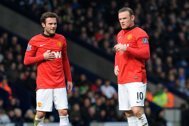 Manchester United's Juan Mata, left, and Wayne Rooney during the English Premier League soccer match between West Bromwich Albion and Manchester United at The Hawthorns Stadium in West Bromwich, England, Saturday, March 8, 2014.  (AP Photo/Rui Vieira)