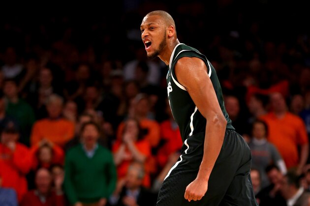 NEW YORK, NY - MARCH 28:  Adreian Payne #5 of the Michigan State Spartans reacts after hitting a three pointer late in the game against Virginia Cavaliers during the regional semifinal of the 2014 NCAA Men's Basketball Tournament at Madison Square Garden on March 28, 2014 in New York City.  (Photo by Elsa/Getty Images)