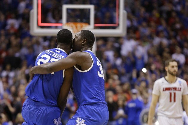 Kentucky's Alex Poythress (22) and Julius Randle (30) celebrate after an NCAA Midwest Regional semifinal college basketball tournament game against the Louisville Saturday, March 29, 2014, in Indianapolis. Kentucky won 74-69. (AP Photo/Michael Conroy)