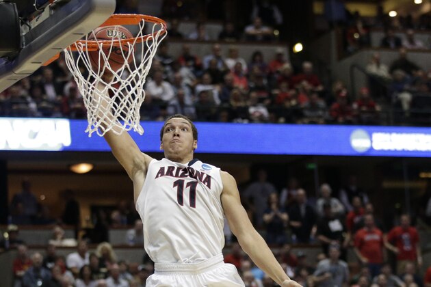 Arizona forward Aaron Gordon (11) dunks as San Diego State forward Matt Shrigley (40) watches during the second half in a regional semifinal of the NCAA men's college basketball tournament, Thursday, March 27, 2014, in Anaheim, Calif. (AP Photo/Jae C. Hong)