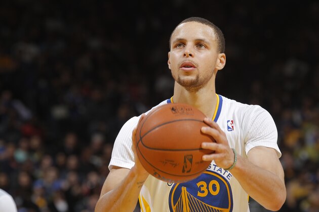 OAKLAND, CA - MARCH 22: Stephen Curry #30 of the Golden State Warriors attempts a free throw shot against the San Antonio Spurs on March 22, 2014 at Oracle Arena in Oakland, California. NOTE TO USER: User expressly acknowledges and agrees that, by downloading and or using this photograph, user is consenting to the terms and conditions of Getty Images License Agreement. Mandatory Copyright Notice: Copyright 2014 NBAE (Photo by Rocky Widner/NBAE via Getty Images)