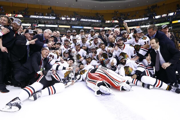 Jun 24, 2013; Boston, MA, USA; Chicago Blackhawks players and coaches pose for a photo with the Stanley Cup after game six of the 2013 Stanley Cup Final against the Boston Bruins at TD Garden. The Blackhawks won 3-2 to win the series four games to two. Mandatory Credit: Greg M. Cooper-USA TODAY Sports Jun 24, 2013; Boston, MA, USA; Chicago Blackhawks players and coaches pose for a photo with the Stanley Cup after game six of the 2013 Stanley Cup Final against the Boston Bruins at TD Garden. The Blackhawks won 3-2 to win the series four games to two. Mandatory Credit: Greg M. Cooper-USA TODAY Sports