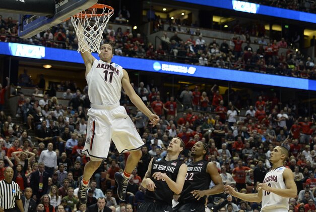 Mar 27, 2014; Anaheim, CA, USA; Arizona Wildcats forward Aaron Gordon (11) dunks the ball past San Diego State Aztecs forward Matt Shrigley (40) during the second half in the semifinals of the west regional of the 2014 NCAA Mens Basketball Championship tournament at Honda Center. Mandatory Credit: Richard Mackson-USA TODAY Sports
