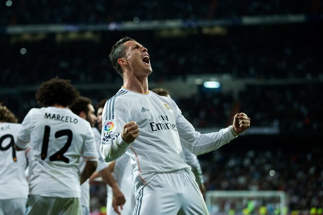MADRID, SPAIN - MARCH 23:  Cristiano Ronaldo of Real Madrid celebrates his team's third goal during the La Liga match between Real Madrid CF and FC Barcelona at Estadio Santiago Bernabeu on March 23, 2014 in Madrid, Spain.  (Photo by Gonzalo Arroyo Moreno/Getty Images)