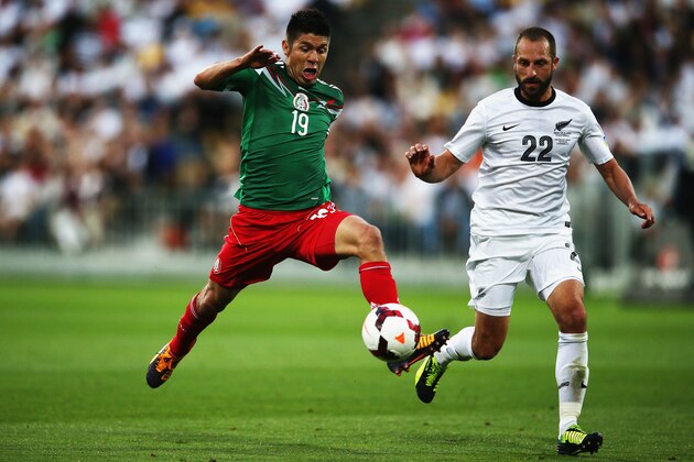 WELLINGTON, NEW ZEALAND - NOVEMBER 20: Oribe Peralta of Mexico reaches out for teh ball past Andrew Durante of New Zealand during leg 2 of the FIFA World Cup Qualifier match between the New Zealand All Whites and Mexico at Westpac Stadium on November 20, 2013 in Wellington, New Zealand. (Photo by Hannah Peters/Getty Images) WELLINGTON, NEW ZEALAND - NOVEMBER 20: Oribe Peralta of Mexico reaches out for teh ball past Andrew Durante of New Zealand during leg 2 of the FIFA World Cup Qualifier match between the New Zealand All Whites and Mexico at Westpac Stadium on November 20, 2013 in Wellington, New Zealand. (Photo by Hannah Peters/Getty Images)