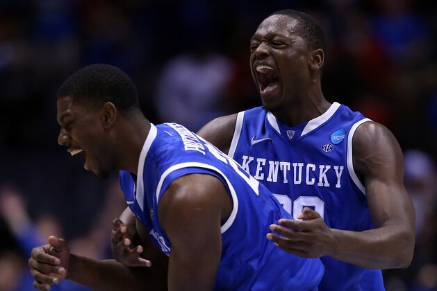 INDIANAPOLIS, IN - MARCH 28: Alex Poythress #22 and Julius Randle #30 of the Kentucky Wildcats celebrate defeating the Louisville Cardinals 74 to 69 during the regional semifinal of the 2014 NCAA Men's Basketball Tournament at Lucas Oil Stadium on March 28, 2014 in Indianapolis, Indiana. (Photo by Jonathan Daniel/Getty Images) INDIANAPOLIS, IN - MARCH 28: Alex Poythress #22 and Julius Randle #30 of the Kentucky Wildcats celebrate defeating the Louisville Cardinals 74 to 69 during the regional semifinal of the 2014 NCAA Men's Basketball Tournament at Lucas Oil Stadium on March 28, 2014 in Indianapolis, Indiana. (Photo by Jonathan Daniel/Getty Images)