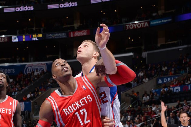 November 4, 2013; Los Angeles, CA, USA; Los Angeles Clippers power forward Blake Griffin (32) moves the ball against the defense of Houston Rockets shooting guard James Harden (13) during the first half at Staples Center. Mandatory Credit: Gary A. Vasquez-USA TODAY Sports