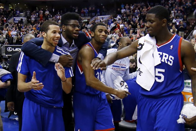 From left to right, Philadelphia 76ers' Michael Carter-Williams, Nerlens Noel, Hollis Thompson and Henry Sims celebrate in the final seconds of an NBA basketball game against the Detroit Pistons, Saturday, March 29, 2014, in Philadelphia. Philadelphia won 123-98, breaking a 26-game losing streak. (AP Photo/Matt Slocum)