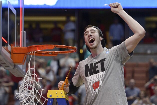 Mar 29, 2014; Anaheim, CA, USA; Wisconsin Badgers forward Frank Kaminsky (44) celebrates cutting the net against the Arizona Wildcats during overtime in the finals of the west regional of the 2014 NCAA Mens Basketball Championship tournament at Honda Center. The Badgers defeated the Wildcats 64-63. Mandatory Credit: Robert Hanashiro-USA TODAY Sports