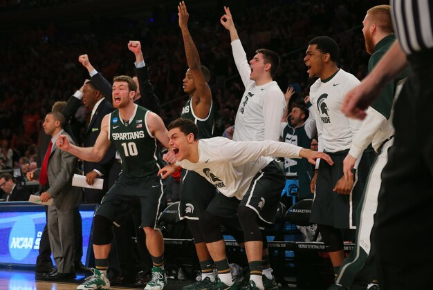 Mar 28, 2014; New York, NY, USA; The Michigan State Spartans bench reacts during the second half against the Virginia Cavaliers in the semifinals of the east regional of the 2014 NCAA Mens Basketball Championship tournament at Madison Square Garden. Mandatory Credit: Adam Hunger-USA TODAY Sports Mar 28, 2014; New York, NY, USA; The Michigan State Spartans bench reacts during the second half against the Virginia Cavaliers in the semifinals of the east regional of the 2014 NCAA Mens Basketball Championship tournament at Madison Square Garden. Mandatory Credit: Adam Hunger-USA TODAY Sports