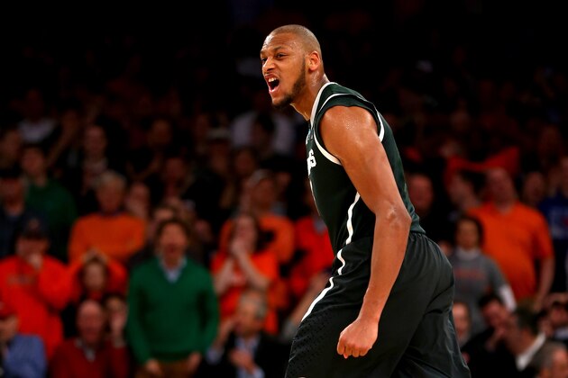Michigan State's Adreian Payne celebrates after scoring in the second half of a regional semifinal against Virginia at the NCAA men's college basketball tournament, early Saturday, March 29, 2014, in New York. Michigan State won 61-59. (AP Photo/Seth Wenig)