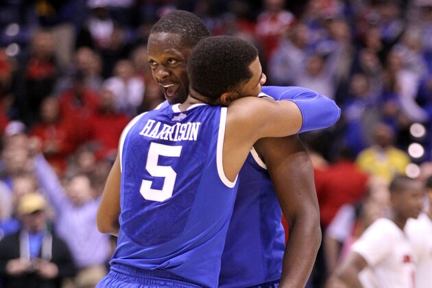 INDIANAPOLIS, IN - MARCH 28:  Andrew Harrison #5 and Julius Randle #30 of the Kentucky Wildcats celebrate defeating the Louisville Cardinals 74 to 69 during the regional semifinal of the 2014 NCAA Men's Basketball Tournament at Lucas Oil Stadium on March 28, 2014 in Indianapolis, Indiana.  (Photo by Andy Lyons/Getty Images)