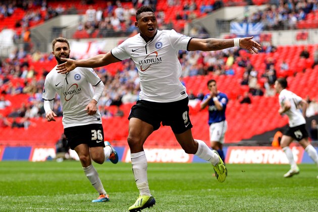 LONDON, ENGLAND - MARCH 30:  Britt Assombalonga of Peterborough celebrates after scoring his team's third goal of the game during the Johnstone's Paint Trophy Final between Chesterfield and Peterborough United at Wembley Stadium on March 30, 2014 in London, England.  (Photo by Ben Hoskins/Getty Images)