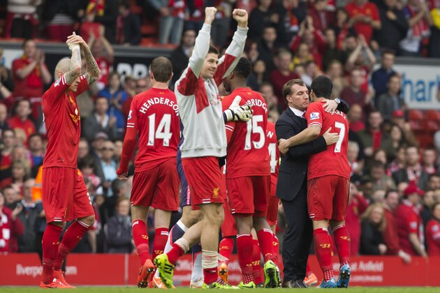 Liverpool's manager Brendan Rodgers, second right, hugs Luis Suarez as he celebrates with his players after their 4-0 win against Tottenham in their English Premier League soccer match at Anfield Stadium, Liverpool, England, Sunday March 30, 2014. (AP Photo/Jon Super) Liverpool's manager Brendan Rodgers, second right, hugs Luis Suarez as he celebrates with his players after their 4-0 win against Tottenham in their English Premier League soccer match at Anfield Stadium, Liverpool, England, Sunday March 30, 2014. (AP Photo/Jon Super)