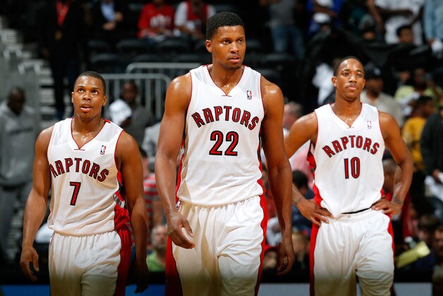 ATLANTA, GA - NOVEMBER 01:  Rudy Gay #22, Kyle Lowry #7 and DeMar DeRozan #10 of the Toronto Raptors react in the final seconds of their 102-95 loss to the Atlanta Hawks at Philips Arena on November 1, 2013 in Atlanta, Georgia.  NOTE TO USER: User expressly acknowledges and agrees that, by downloading and or using this photograph, User is consenting to the terms and conditions of the Getty Images License Agreement.  (Photo by Kevin C. Cox/Getty Images)