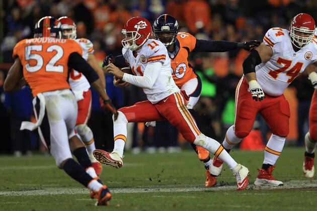 DENVER, CO - NOVEMBER 17: Quarterback Alex Smith #11 of the Kansas City Chiefs rushes with the ball and eludes defensive end Shaun Phillips #90 of the Denver Broncos at Sports Authority Field at Mile High on November 17, 2013 in Denver, Colorado. The Broncos defeated the Chiefs 27-17. (Photo by Doug Pensinger/Getty Images) DENVER, CO - NOVEMBER 17: Quarterback Alex Smith #11 of the Kansas City Chiefs rushes with the ball and eludes defensive end Shaun Phillips #90 of the Denver Broncos at Sports Authority Field at Mile High on November 17, 2013 in Denver, Colorado. The Broncos defeated the Chiefs 27-17. (Photo by Doug Pensinger/Getty Images)