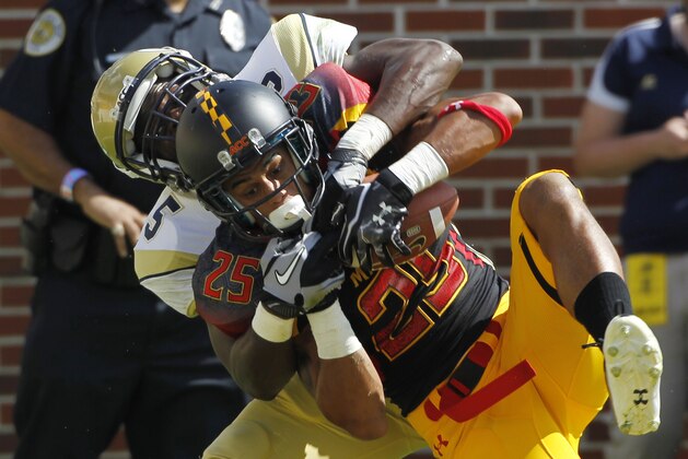 Maryland defensive back Dexter McDougle (25) intercepts a pass intended for Georgia Tech wide receiver Stephen Hill (5) during the second quarter of an NCAA college football game, Saturday, Oct, 8, 2011 in Atlanta .  (AP Photo/John Bazemore)