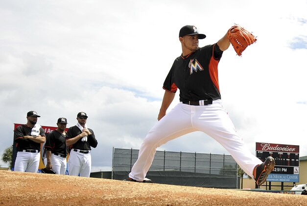 Mar 25, 2014; Jupiter, FL, USA; Miami Marlins starting pitcher Jose Fernandez (16) warms up in the bullpen before a game against the St. Louis Cardinals at Roger Dean Stadium. Mandatory Credit: Steve Mitchell-USA TODAY Sports