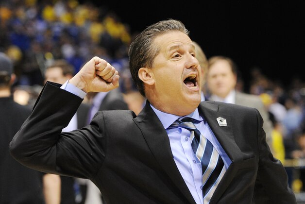 Mar 30, 2014; Indianapolis, IN, USA; Kentucky Wildcats head coach John Calipari pumps his fist after defeating the Michigan Wolverines in the finals of the midwest regional of the 2014 NCAA Mens Basketball Championship tournament at Lucas Oil Stadium. Mandatory Credit: Thomas J. Russo-USA TODAY Sports