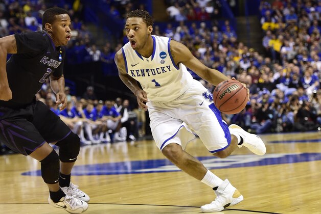 Mar 21, 2014; St. Louis, MO, USA; Kentucky Wildcats guard/forward James Young (1) dribbles past Kansas State Wildcats guard Marcus Foster (2) in the first half during the 2nd round of the 2014 NCAA Men's Basketball Championship at Scottrade Center. Mandatory Credit: Scott Rovak-USA TODAY Sports Mar 21, 2014; St. Louis, MO, USA; Kentucky Wildcats guard/forward James Young (1) dribbles past Kansas State Wildcats guard Marcus Foster (2) in the first half during the 2nd round of the 2014 NCAA Men's Basketball Championship at Scottrade Center. Mandatory Credit: Scott Rovak-USA TODAY Sports