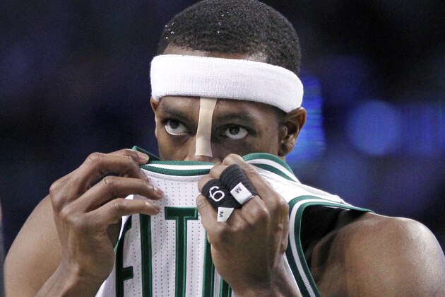 Boston Celtics guard Rajon Rondo (9) wipes his face with his jersey in the second half of an NBA basketball game against the Toronto Raptors in Boston, Wednesday, March 26, 2014. (AP Photo/Elise Amendola)