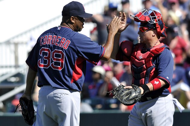 Mar 13, 2014; Fort Myers, FL, USA; Boston Red Sox pitcher Francisco Cordero (left) greets catcher Christian Vazquez (right) after defeating the Minnesota Twins 4-3 at Hammond Stadium. Mandatory Credit: Steve Mitchell-USA TODAY Sports