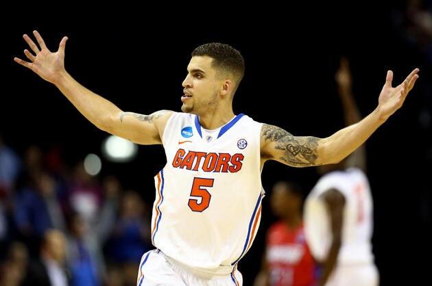 MEMPHIS, TN - MARCH 29:  Scottie Wilbekin #5 of the Florida Gators celebrates after hitting a three pointer to end the first half against the Dayton Flyers during the south regional final of the 2014 NCAA Men's Basketball Tournament at the FedExForum on March 29, 2014 in Memphis, Tennessee.  (Photo by Streeter Lecka/Getty Images)