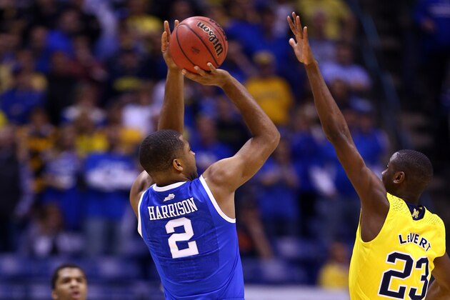 INDIANAPOLIS, IN - MARCH 30:  Aaron Harrison #2 of the Kentucky Wildcats shoots the game winning shot late against Caris LeVert #23 of the Michigan Wolverines during the midwest regional final of the 2014 NCAA Men's Basketball Tournament at Lucas Oil Stadium on March 30, 2014 in Indianapolis, Indiana. The Kentucky Wildcats defeated the Michigan Wolverines 75 to 72.  (Photo by Andy Lyons/Getty Images)