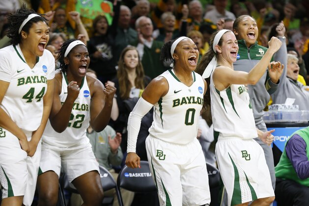 Baylor's Kristina Higgins, from left, Sune Agbuke, Odyssey Sims, and Makenzie Robertson celebrate on the bench in the closing moments against Kentucky during the second half of their NCAA women's college basketball tournament regional semifinal at the Purcell Pavilion in South Bend, Ind., Saturday, March 29, 2014. Baylow won 90-72. (AP Photo/Paul Sancya)