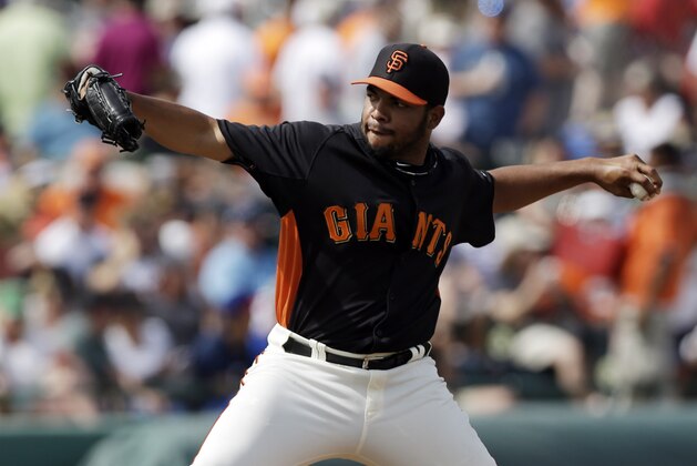 San Francisco Giants starting pitcher Edwin Escobar throws to the Texas Rangers during  an exhibition spring training baseball game on Friday, March 15, 2013 in Scottsdale, Ariz. (AP Photo/Marcio Jose Sanchez)