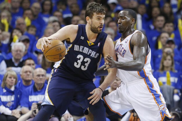 Memphis Grizzlies center Marc Gasol (33) drives around Oklahoma City Thunder center Kendrick Perkins (5) during Game 1 of their Western Conference Semifinals NBA basketball playoff series in Oklahoma City, Sunday, May 5, 2013. Oklahoma City won 93-91. (AP Photo/Sue Ogrocki)