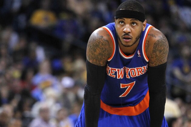 Mar 30, 2014; Oakland, CA, USA; New York Knicks forward Carmelo Anthony (7) rest on the court against the Golden State Warriors in the third quarter at Oracle Arena. The Knicks won 89-84. Mandatory Credit: Cary Edmondson-USA TODAY Sports