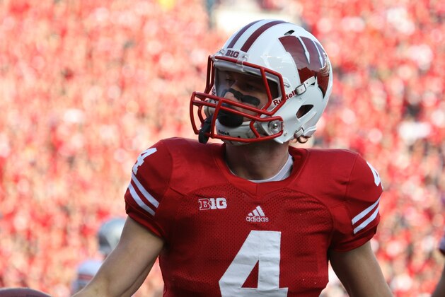 Nov 17, 2012; Madison, WI, USA; Wisconsin Badgers wide receiver Jared Abbrederis (4) after returning an Ohio State Buckeyes punt during the first half at Camp Randall Stadium.  Mandatory Credit: Mary Langenfeld-USA TODAY Sports