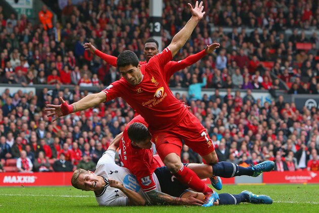 LIVERPOOL, ENGLAND - MARCH 30:  Luis Suarez celebrates after Jordan Henderson of Liverpool scored the fourth goal during the Barclays Premier League match between Liverpool and Tottenham Hotspur at Anfield on March 30, 2014 in Liverpool, England.  (Photo by Alex Livesey/Getty Images)