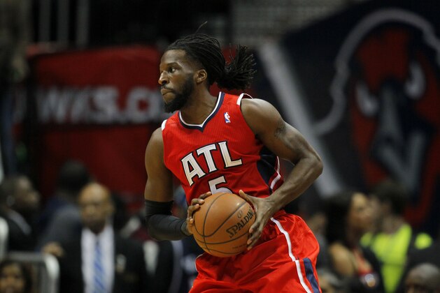 Atlanta Hawks small forward DeMarre Carroll (5) looks to pass in the first period in an NBA basketball game against the Miami Heat in Atlanta, Monday, Jan. 20, 2014. (AP Photo/Todd Kirkland)
