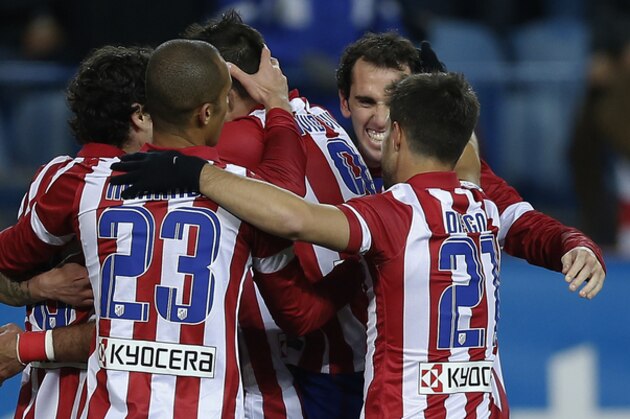 Atletico's Diego Costa celebrates his goal with team mates during a Spanish La Liga soccer match between Atletico Madrid and Granada at the Vicente Calderon stadium in Madrid, Spain, Wednesday, March 26, 2014. (AP Photo/Andres Kudacki)