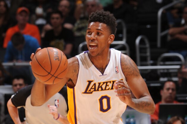 LOS ANGELES, CA - MARCH 30: Nick Young #0 of the Los Angeles Lakers drives against the Phoenix Suns at STAPLES Center on March 30, 2014 in Los Angeles, California. NOTE TO USER: User expressly acknowledges and agrees that, by downloading and/or using this Photograph, user is consenting to the terms and conditions of the Getty Images License Agreement. Mandatory Copyright Notice: Copyright 2014 NBAE (Photo by Andrew D. Bernstein/NBAE via Getty Images)