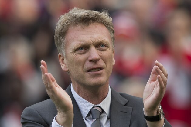 Manchester United's manager David Moyes applauds supporters after his team's 4-1 win against Aston Villa in their English Premier League soccer match at Old Trafford Stadium, Manchester, England, Saturday March 29, 2014. (AP Photo/Jon Super)