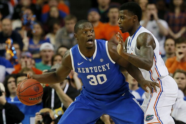 ATLANTA, GA - MARCH 16:  Julius Randle #30 of the Kentucky Wildcats drives against Casey Prather #24 of the Florida Gators in the first half during the Championship game of the 2014 Men's SEC Basketball Tournament at Georgia Dome on March 16, 2014 in Atlanta, Georgia.  (Photo by Kevin C. Cox/Getty Images)