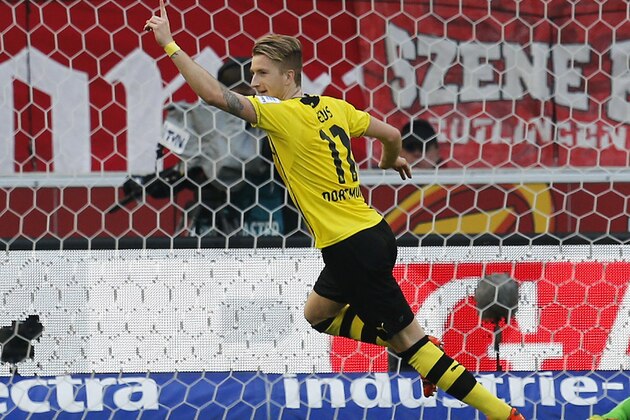 Dortmund's Marco Reus celebrates his side's third goal during a soccer match of German Bundesliga between VfB Stuttgart and Borussia Dortmund in Stuttgart, Germany, Saturday, March 29, 2014. (AP Photo/Michael Probst) Dortmund's Marco Reus celebrates his side's third goal during a soccer match of German Bundesliga between VfB Stuttgart and Borussia Dortmund in Stuttgart, Germany, Saturday, March 29, 2014. (AP Photo/Michael Probst)