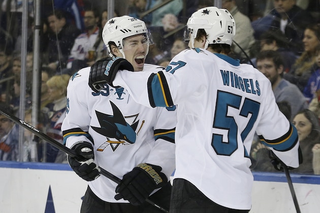 San Jose Sharks' Logan Couture, left, celebrates with teammate Tommy Wingels (57) during the first period of an NHL hockey game against the New York Rangers, Sunday, March 16, 2014, in New York. (AP Photo/Frank Franklin II) San Jose Sharks' Logan Couture, left, celebrates with teammate Tommy Wingels (57) during the first period of an NHL hockey game against the New York Rangers, Sunday, March 16, 2014, in New York. (AP Photo/Frank Franklin II)