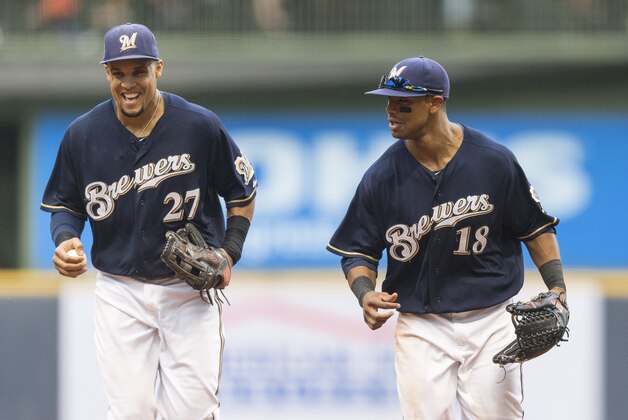 MILWAUKEE, WI - AUGUST 3: Khris Davis #18 of the Milwaukee Brewers and teammate Carlos Gomez #27 run off the field against the Washington Nationals at Miller Park on August 3, 2013 in Milwaukee, Wisconsin. (Photo by Tom Lynn/Getty Images) MILWAUKEE, WI - AUGUST 3: Khris Davis #18 of the Milwaukee Brewers and teammate Carlos Gomez #27 run off the field against the Washington Nationals at Miller Park on August 3, 2013 in Milwaukee, Wisconsin. (Photo by Tom Lynn/Getty Images)
