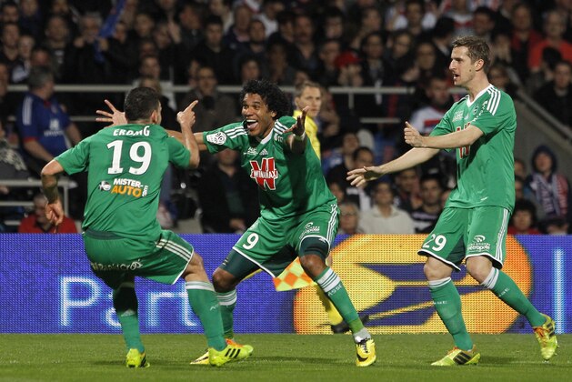 Saint-Etienne's Brandao, center, celebrates with Meviut Erding, left, and Francois Clerc, right, after Erding scored a goal against Lyon during their French League One soccer match in Lyon, central France, Sunday, March 30, 2014. (AP Photo/Laurent Cipriani) Saint-Etienne's Brandao, center, celebrates with Meviut Erding, left, and Francois Clerc, right, after Erding scored a goal against Lyon during their French League One soccer match in Lyon, central France, Sunday, March 30, 2014. (AP Photo/Laurent Cipriani)