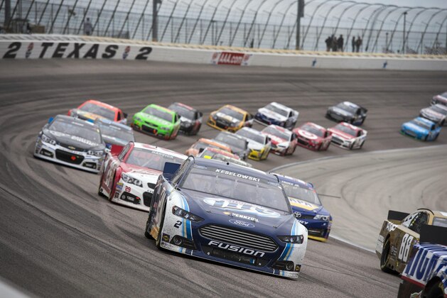 Nov 3, 2013; Fort Worth, TX, USA; Sprint Cup Series driver Brad Keselowski (2) and the field drive through turn two during the AAA Texas 500 at Texas Motor Speedway. Mandatory Credit: Jerome Miron-USA TODAY Sports
