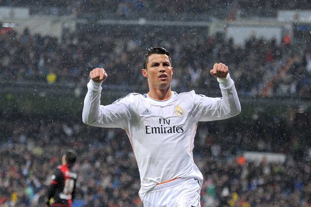 MADRID, SPAIN - MARCH 29:  Cristiano Ronaldo of Real Madrid FC celebrates after scoring his team's opening goal during the La Liga match between Real Madrid CF and Rayo Vallecano de Madrid at Santiago Bernabeu stadium on March 29, 2014 in Madrid, Spain.  (Photo by Denis Doyle/Getty Images)