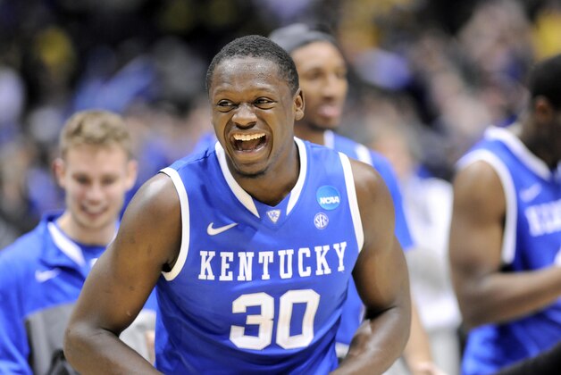 Mar 30, 2014; Indianapolis, IN, USA; Kentucky Wildcats forward Julius Randle (30) celebrates after defeating the Michigan Wolverines in the finals of the midwest regional of the 2014 NCAA Mens Basketball Championship tournament at Lucas Oil Stadium. Mandatory Credit: Thomas J. Russo-USA TODAY Sports