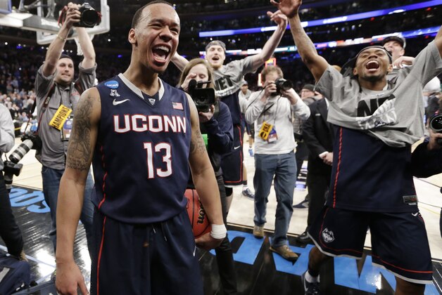Connecticut's Shabazz Napier (13) celebrates after his team defeated Michigan State 60-54 in a regional final at the NCAA college basketball tournament, Sunday, March 30, 2014, in New York. Napier scored 17 points of his 25 points in the second half. (AP Photo/Frank Franklin II) Connecticut's Shabazz Napier (13) celebrates after his team defeated Michigan State 60-54 in a regional final at the NCAA college basketball tournament, Sunday, March 30, 2014, in New York. Napier scored 17 points of his 25 points in the second half. (AP Photo/Frank Franklin II)