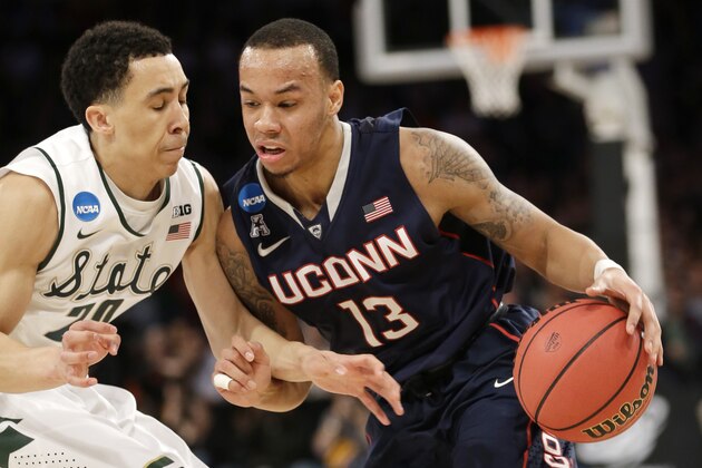 Connecticut's Shabazz Napier, right, moves the ball around Michigan State's Travis Trice in the first half of a regional final at the NCAA college basketball tournament on Sunday, March 30, 2014, in New York. (AP Photo/Seth Wenig) Connecticut's Shabazz Napier, right, moves the ball around Michigan State's Travis Trice in the first half of a regional final at the NCAA college basketball tournament on Sunday, March 30, 2014, in New York. (AP Photo/Seth Wenig)